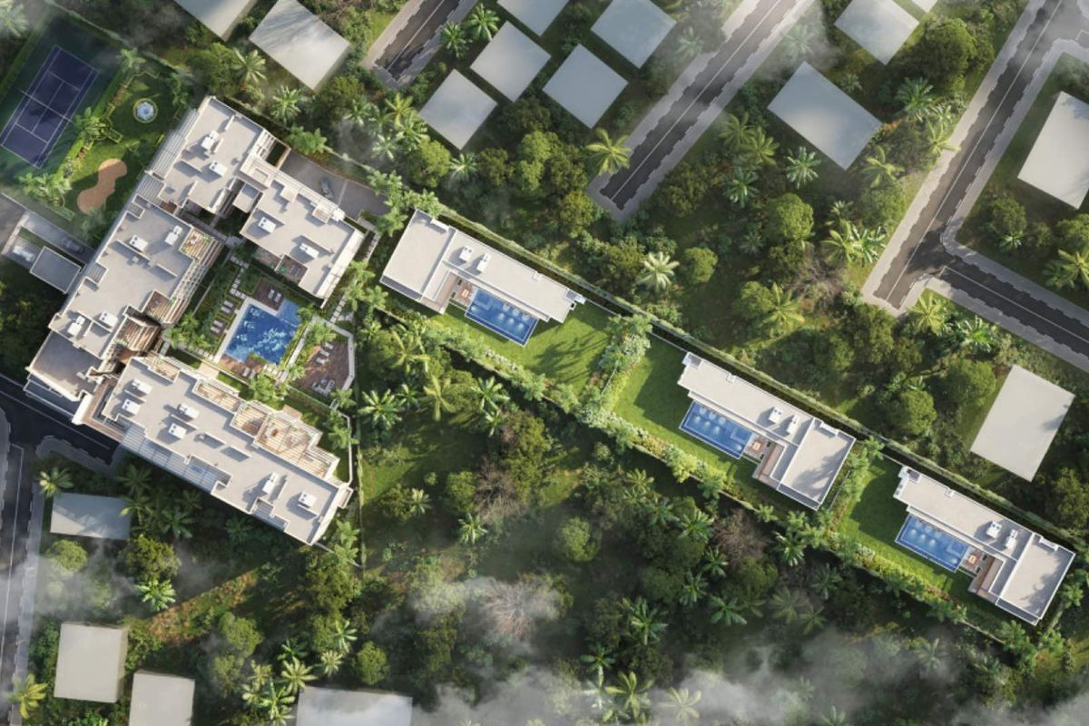 Aerial view of a residential estate featuring multiple buildings, private swimming pools, landscaped gardens, and a tennis court.
