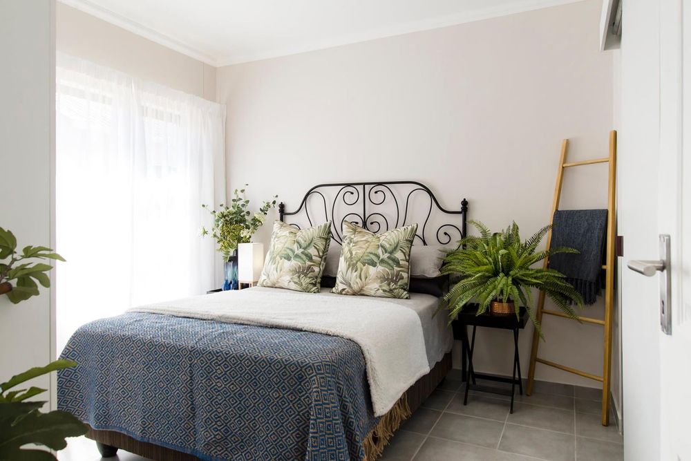 Main bedroom with built-in cupboards and ensuite bathroom.