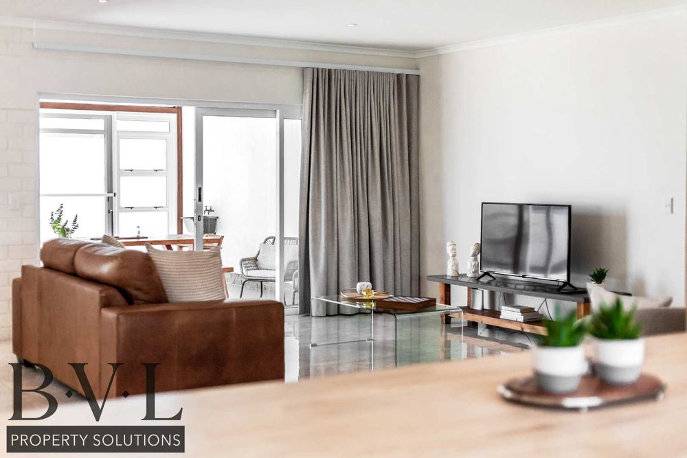 Lounge with sliding door leading out to enclosed courtyard