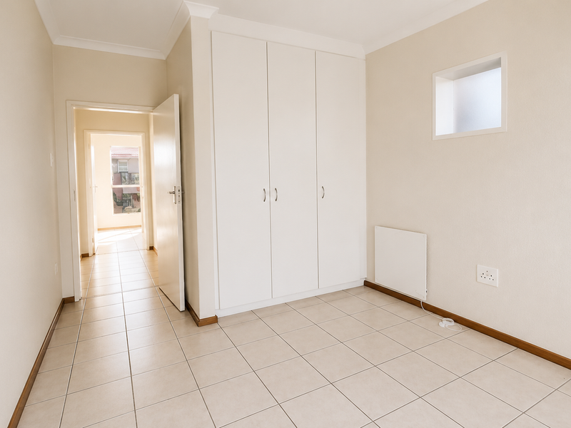 Spacious 2-Bed, 1-Bath Townhouse with Balcony Views - Photo 9