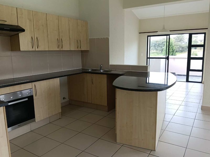 Stylish Golf Estate Living | Spacious Penthouse Apartment with Dual Balconies in Jackal Creek - Photo 3