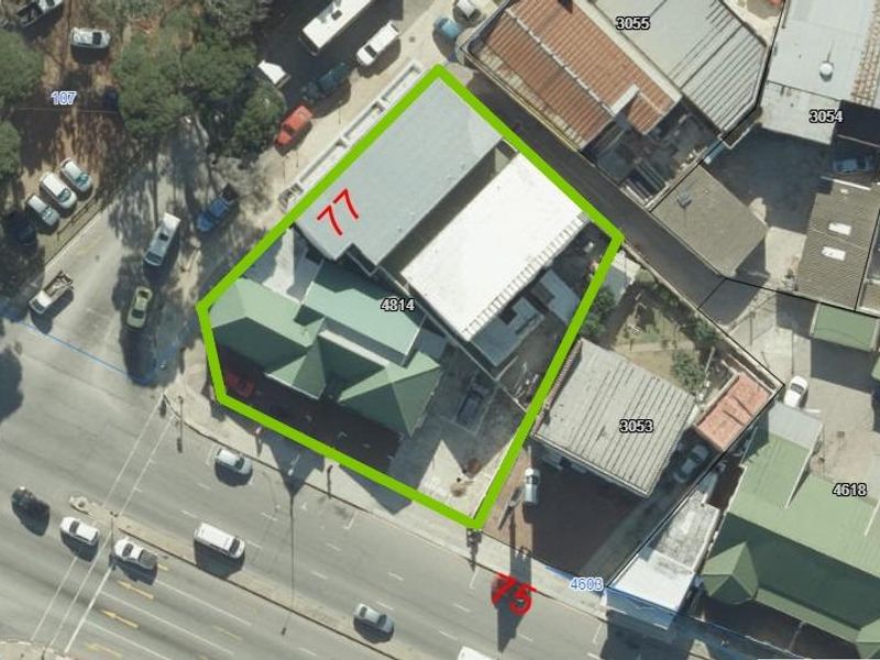 Aerial view of the property showing the building footprint, roof structure, and surrounding site layout.