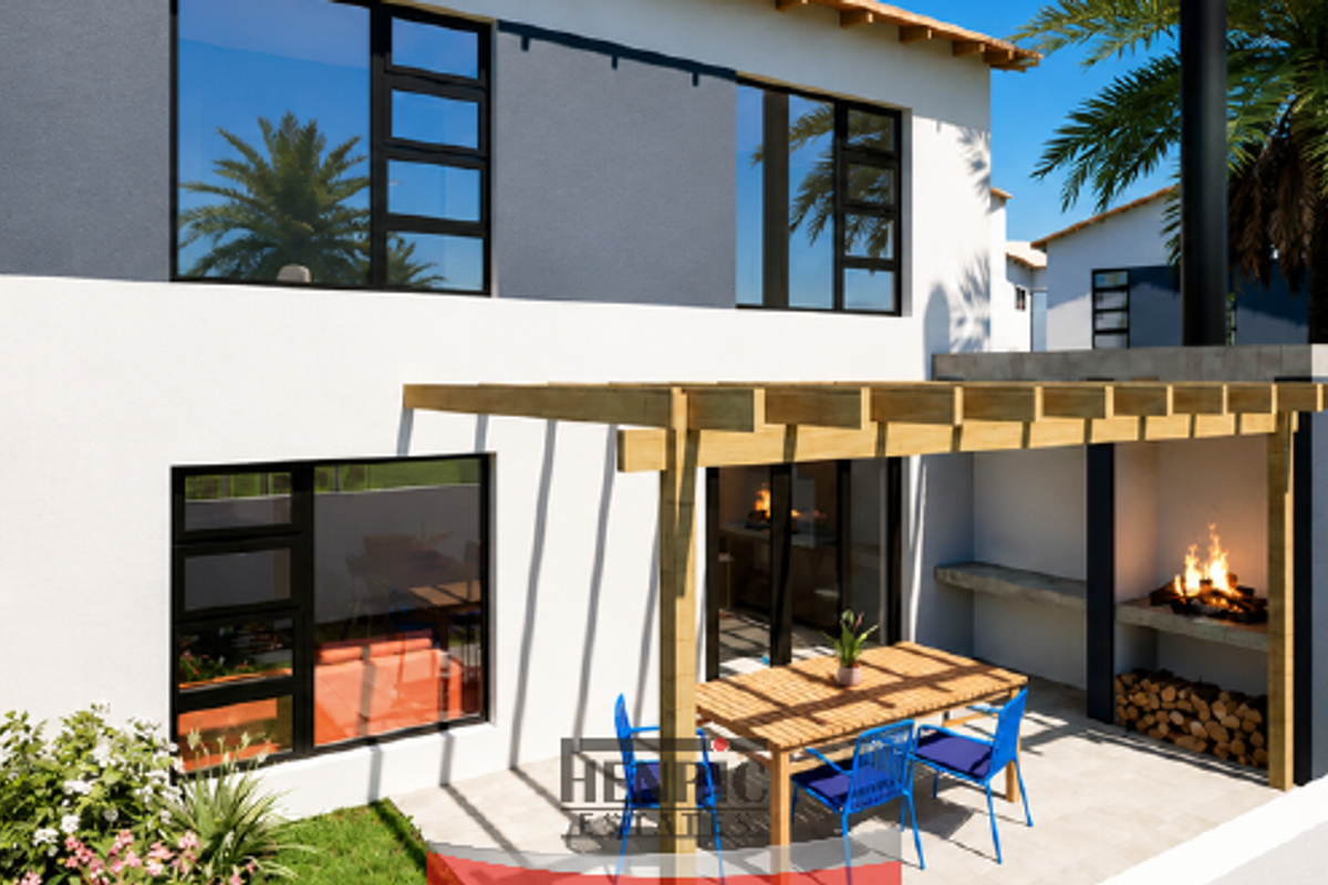 Rear exterior view of a modern townhouse featuring a paved patio, timber pergola, and a built-in braai area.