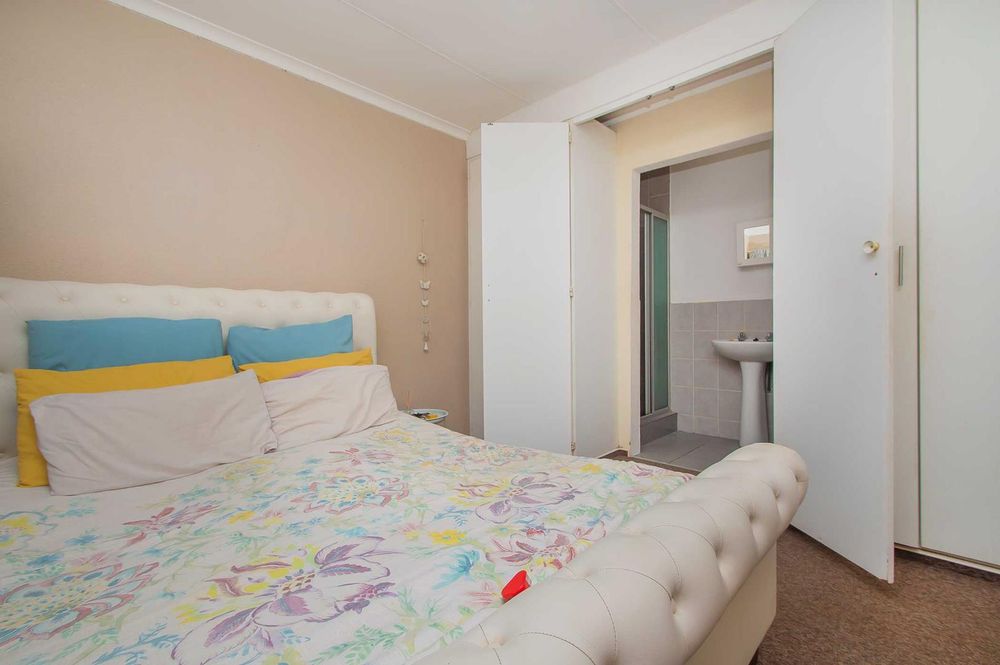 Ample cupboards and entrance to en-suite