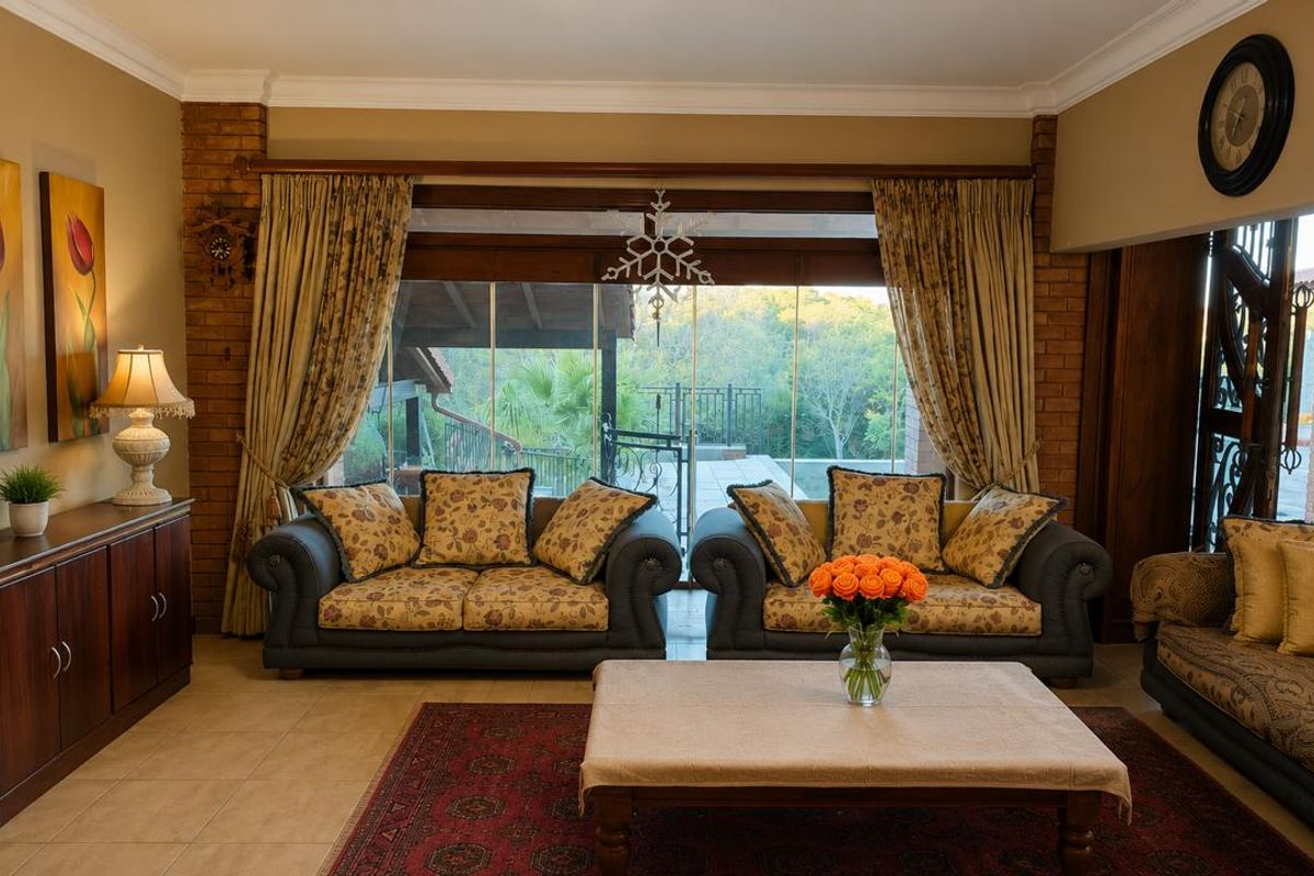 A comfortable living room featuring exposed brick accents, large glass sliding doors leading to an outdoor area, and tiled flooring.