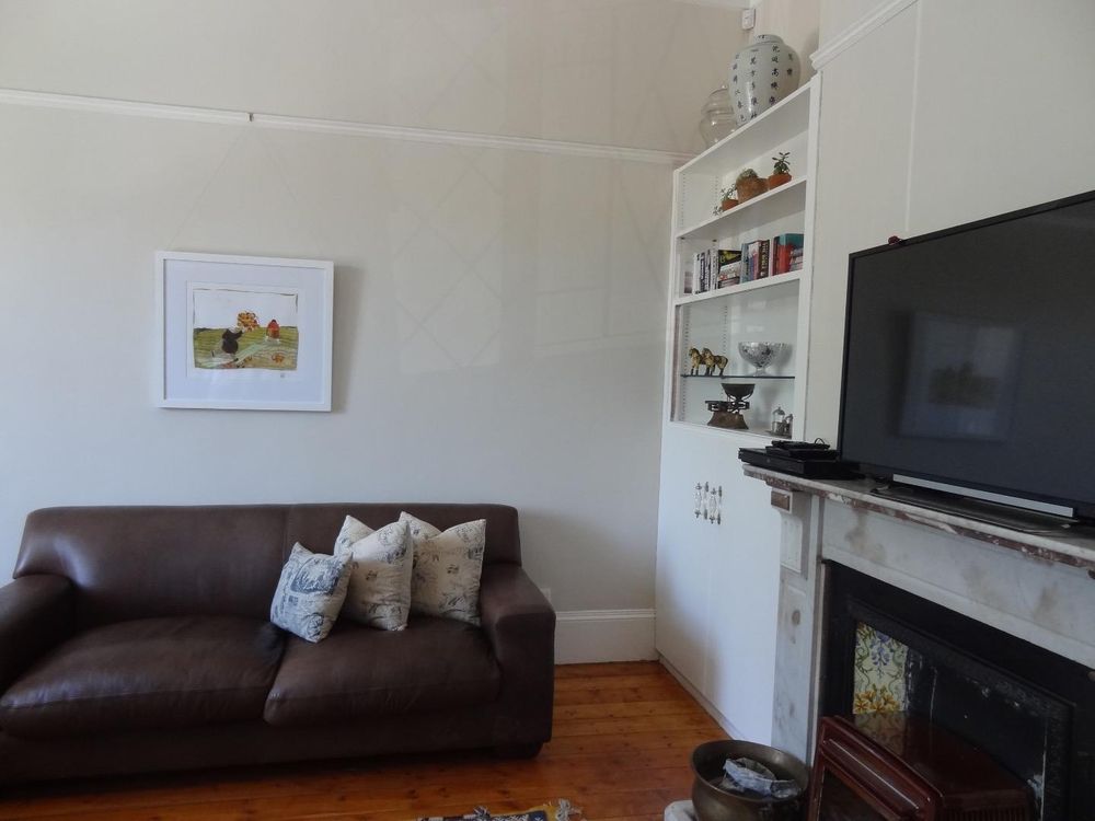 Lounge with a vintage coal fireplace