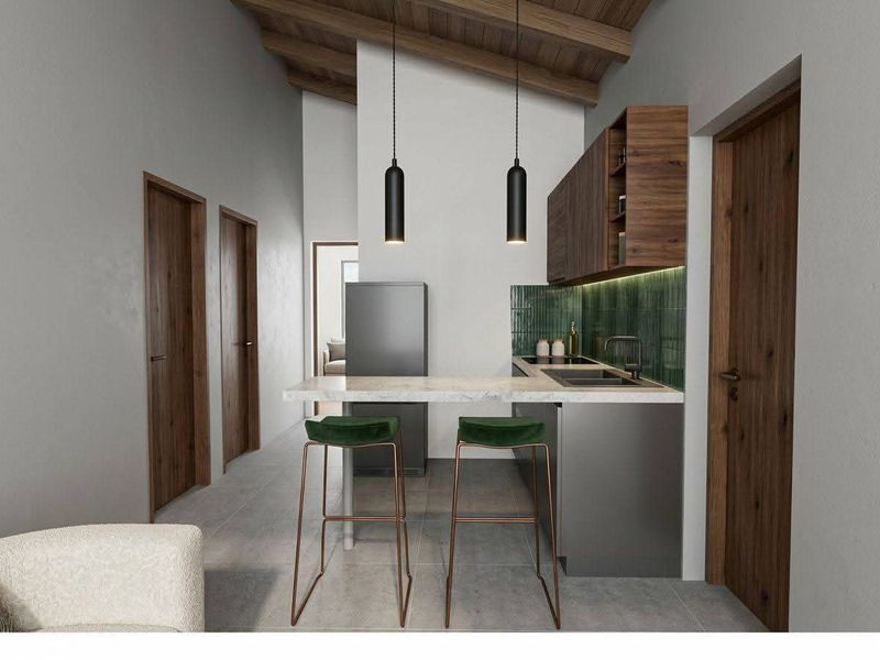 Modern kitchen featuring sleek cabinetry, stone countertops, green tiled backsplash, and exposed timber ceiling beams, creating a contemporary and stylish culinary space.