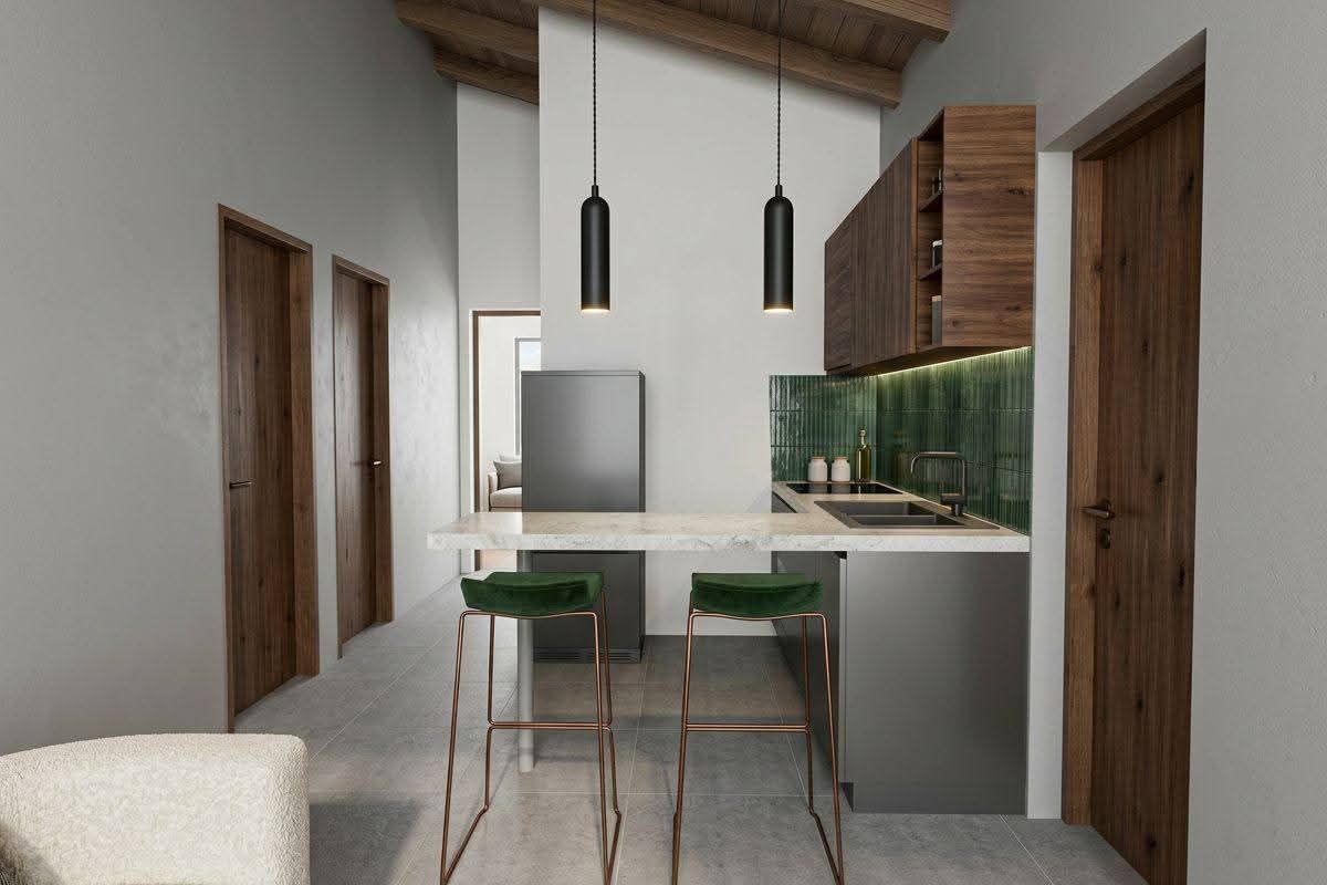 Modern kitchen featuring sleek cabinetry, stone countertops, green tiled backsplash, and exposed timber ceiling beams, creating a contemporary and stylish culinary space.