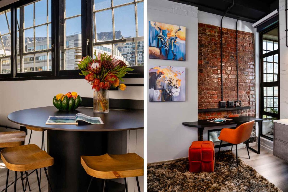A stylish living area featuring exposed brick walls, industrial-style window frames, and modern finishes with views of the surrounding cityscape.