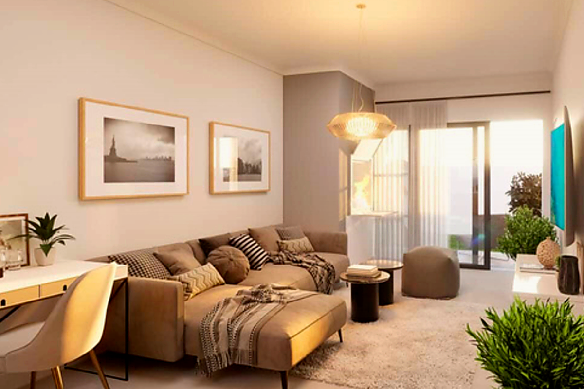 A well-lit living room featuring a sliding glass door leading to an outdoor area, complemented by modern pendant lighting and neutral finishes.