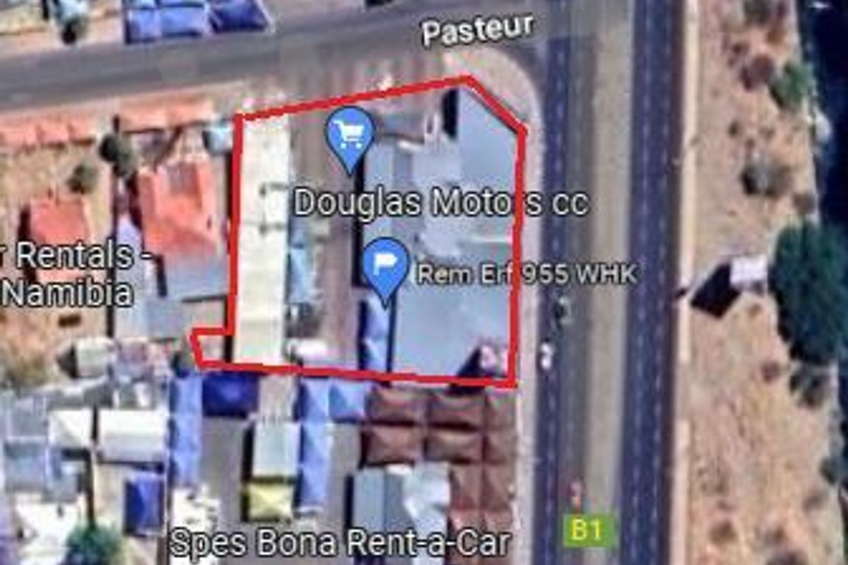 Aerial view of the property site located at Rem Erf 955, highlighting the building footprint and surrounding commercial infrastructure.