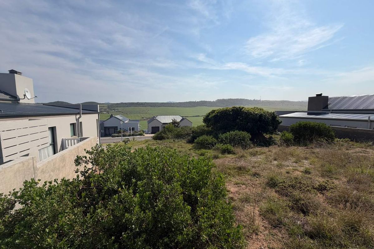 A scenic view overlooking the surrounding residential estate and natural landscape, showcasing the property's elevated position and open outlook.