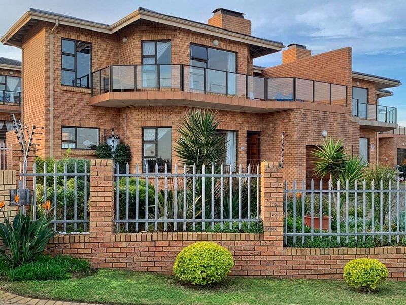 HOME OF DISTINCTION IN SMALL COMPLEX WITH SEA VIEWS - Photo 1