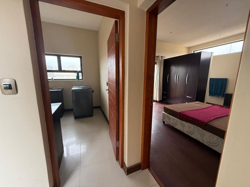 Bedroom 1 (right) and laundry room (left)