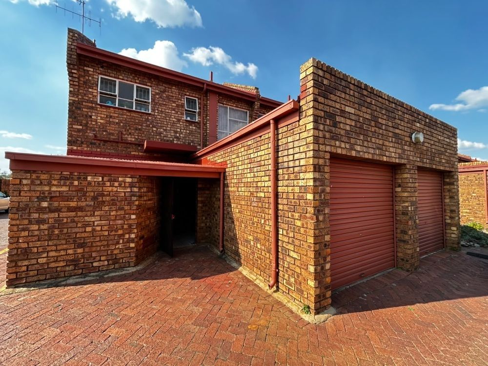 Entrance and one lock up garage