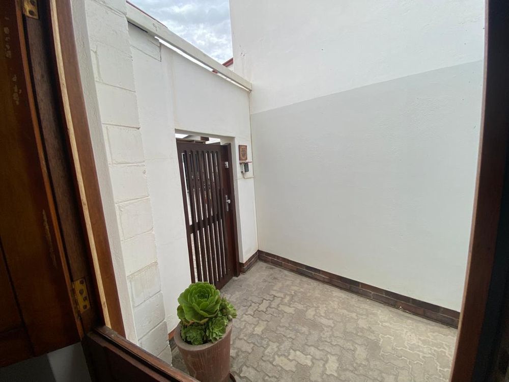 Door of second flat on the side of the house