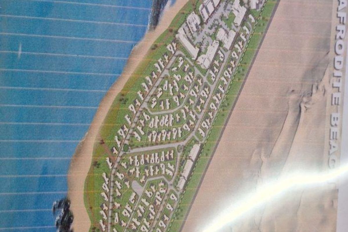 An aerial site plan showing the layout of the Afrodite Beach residential development situated between the ocean and the Namib Desert.