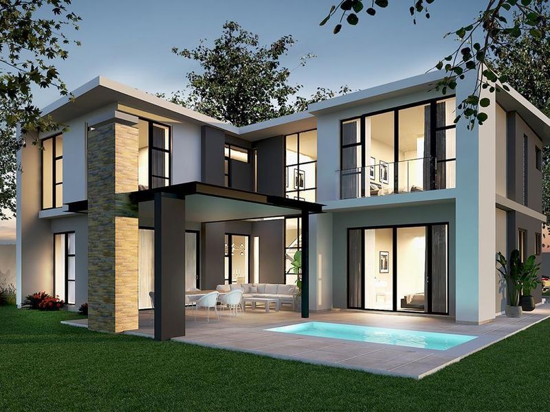Modern double-story cluster home featuring a rear patio, swimming pool, stone-clad architectural detailing, and large glass sliding doors opening to the garden.