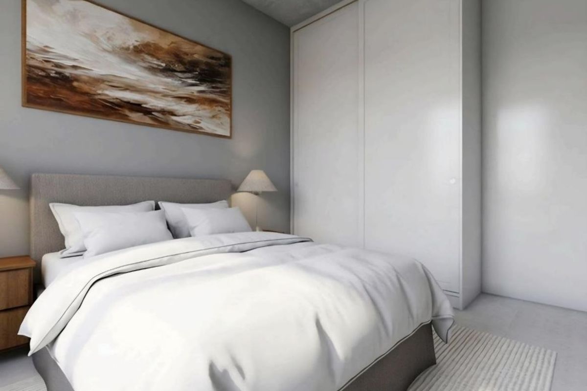 A modern, well-lit bedroom featuring a large built-in wardrobe with clean lines and a neutral color palette.