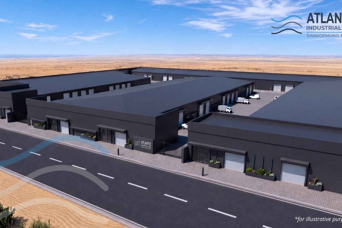 Aerial perspective of the Atlantic Industrial Park in Swakopmund, featuring modern warehouse units with roller shutter doors and paved access infrastructure.