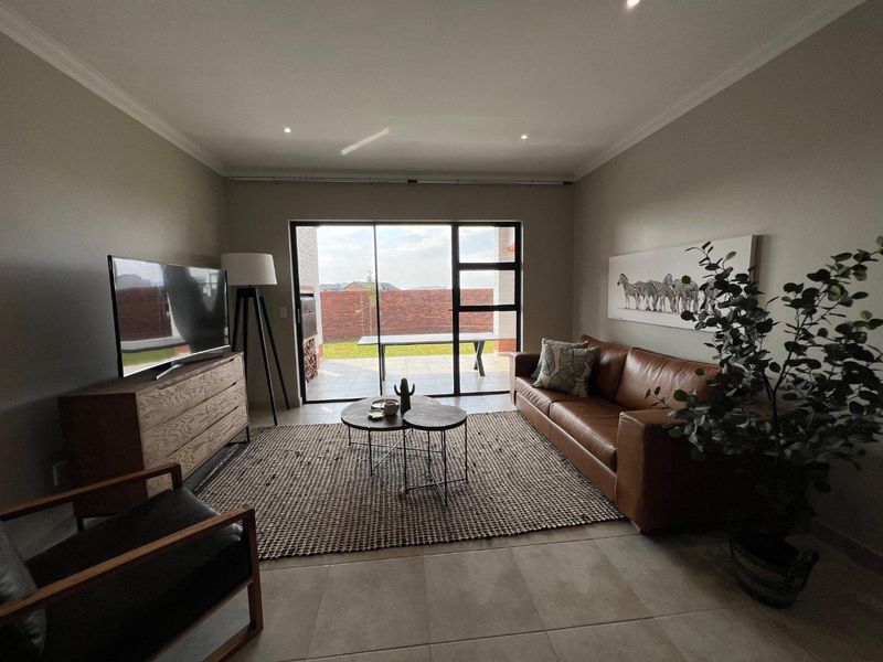 Unique iQ Marula 3-Bedroom Single-Level Townhouse with stacking doors by the patio and Double Garage - Photo 7