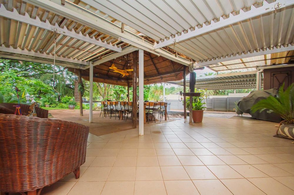 Covered patio off lounge and dining compliments thatch lapa and entertainment area