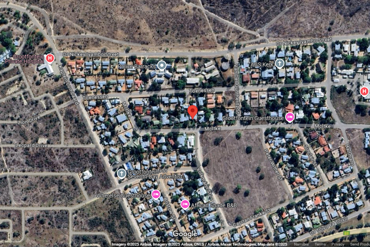 An aerial satellite view of the residential neighborhood surrounding the property, showing local street layouts and proximity to nearby landmarks and infrastructure.