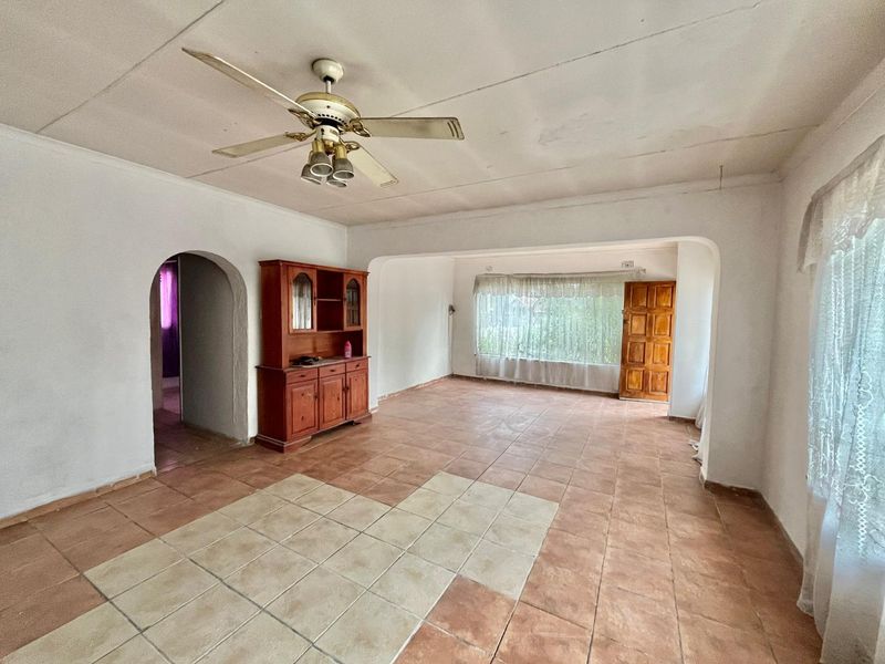 Fixer-Upper Awaits!  Three bedroom house with a potential flat and double garage fit 4 cars - Photo 2