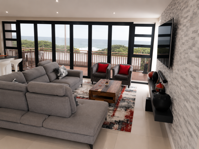 Modern living room featuring a stone accent wall, large sliding doors opening to a balcony with ocean views, and sleek tiled flooring.