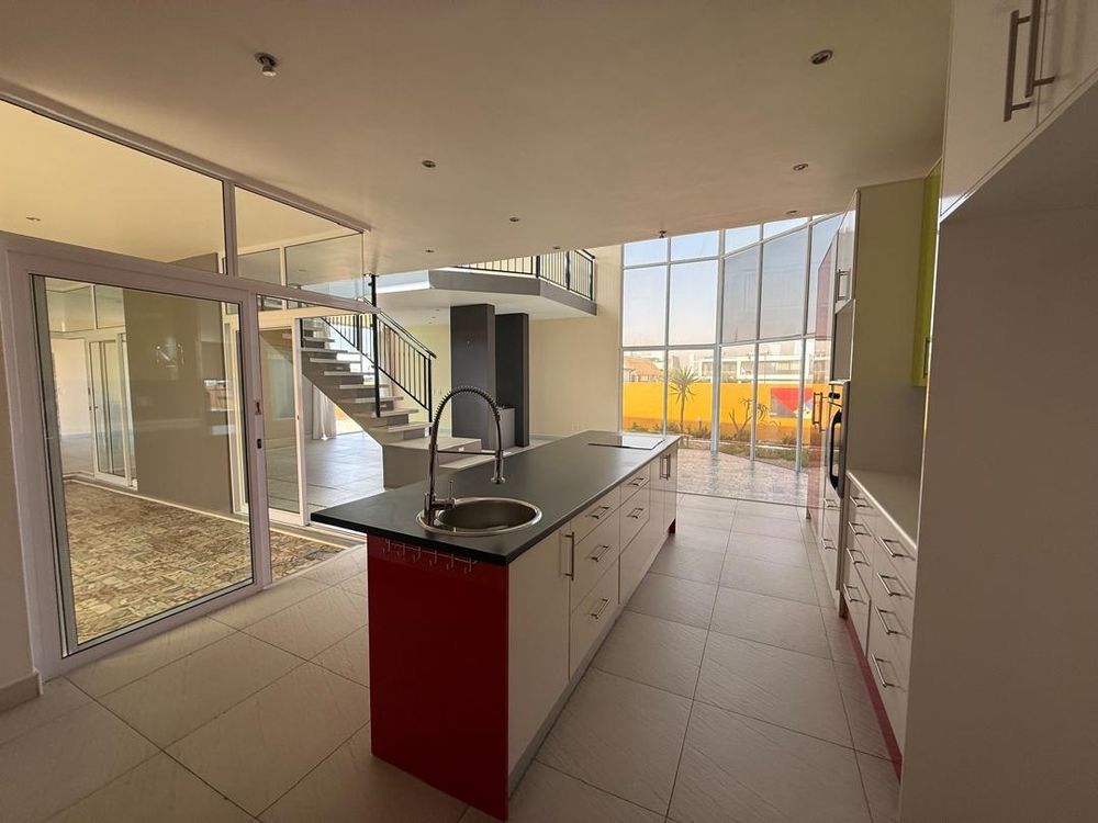 Open-plan kitchen with built-in cupboards