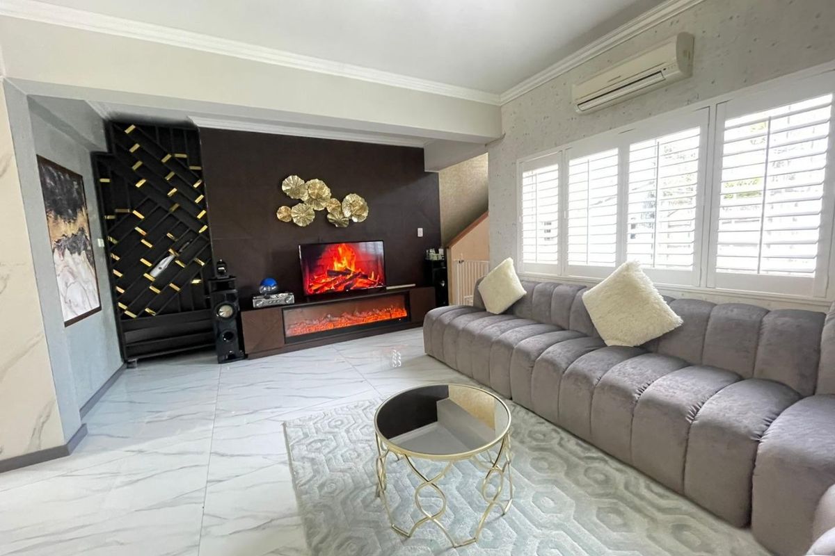 Modern living room featuring marble-look floor tiles, plantation shutters, built-in wine storage, and a wall-mounted air conditioning unit.