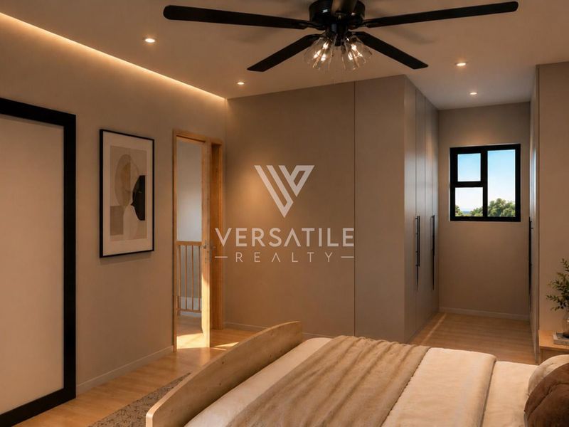 Modern bedroom featuring built-in cupboards, recessed and cove lighting, and a ceiling fan, creating a warm and inviting atmosphere.