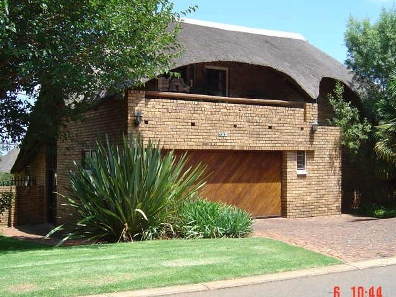 Safe double story thatched roof house in security boomed area situated in Faerie Glen/Olympus - Photo 9