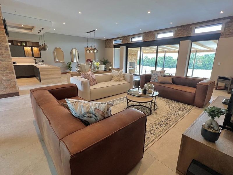INCOME GENERATING HOME Welcome to this charming 4 bedroom home nestled within Highland Gate Golf Estate - Photo 1