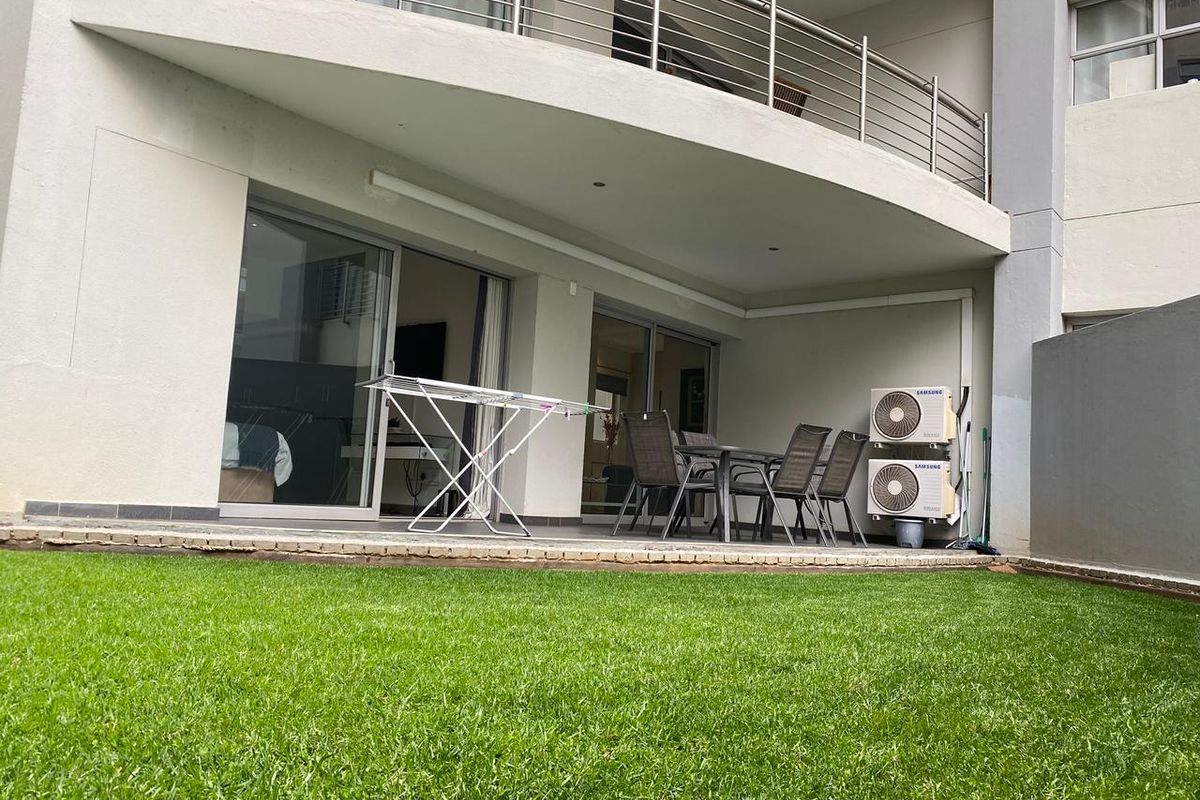 A STUNNING FURNISHED TWO BEDROOM GARDEN APARTMENT - Photo 3