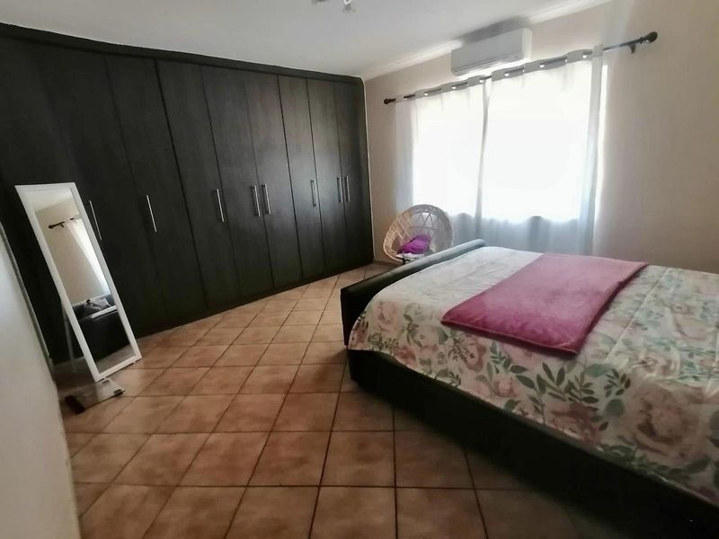 This charming 3-bedroom home offers spacious living areas, a modern kitchen, and a cozy backyard perfect for relaxation. - Photo 5