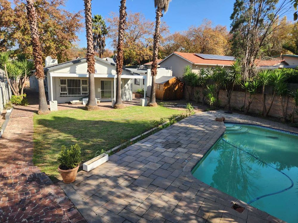 View from braai across pool and back yard