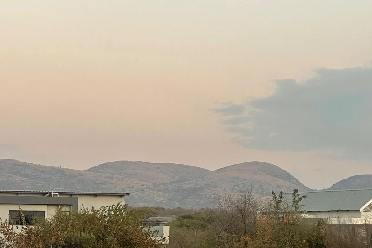 A scenic view of the surrounding hills and landscape, capturing the natural beauty of the area.