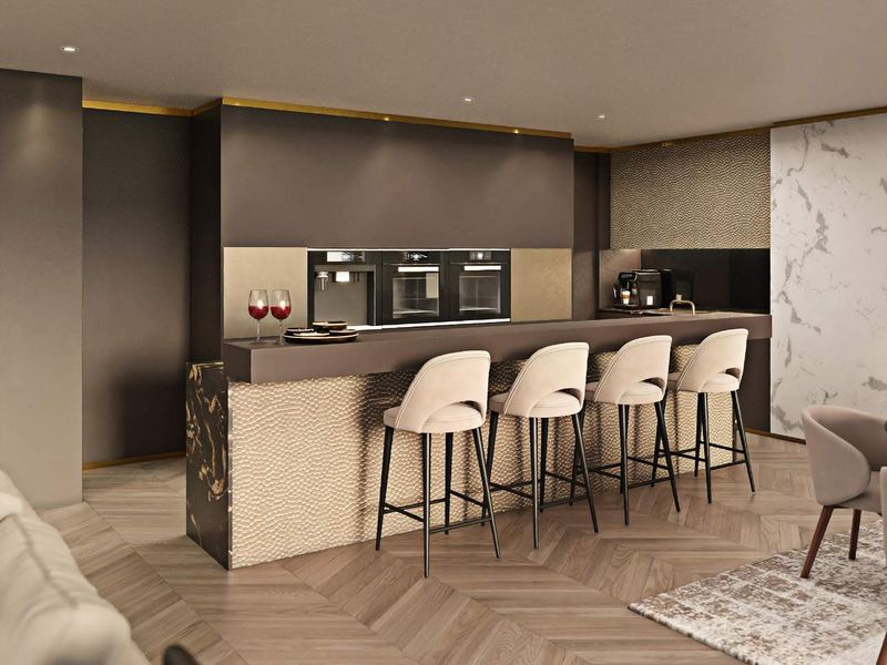 Modern luxury kitchen featuring a stone island, integrated appliances, herringbone timber flooring, and elegant marble wall accents.