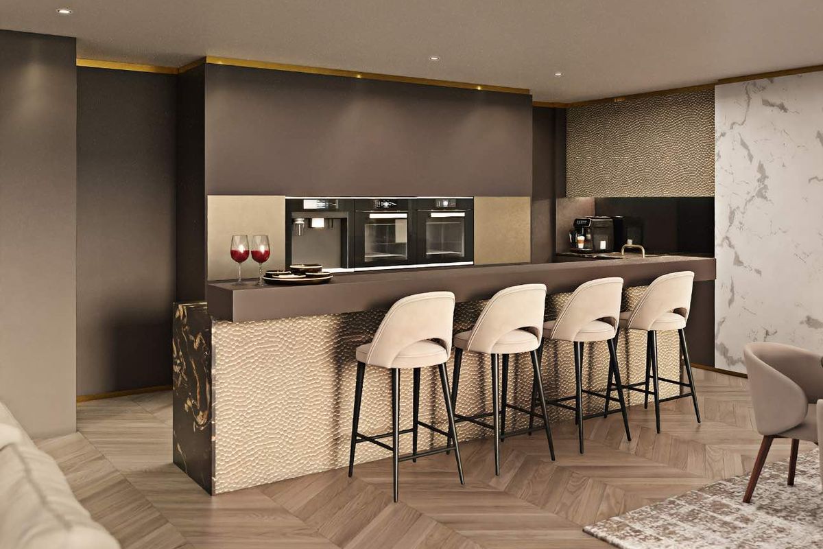 Modern luxury kitchen featuring a stone island, integrated appliances, herringbone timber flooring, and elegant marble wall accents.