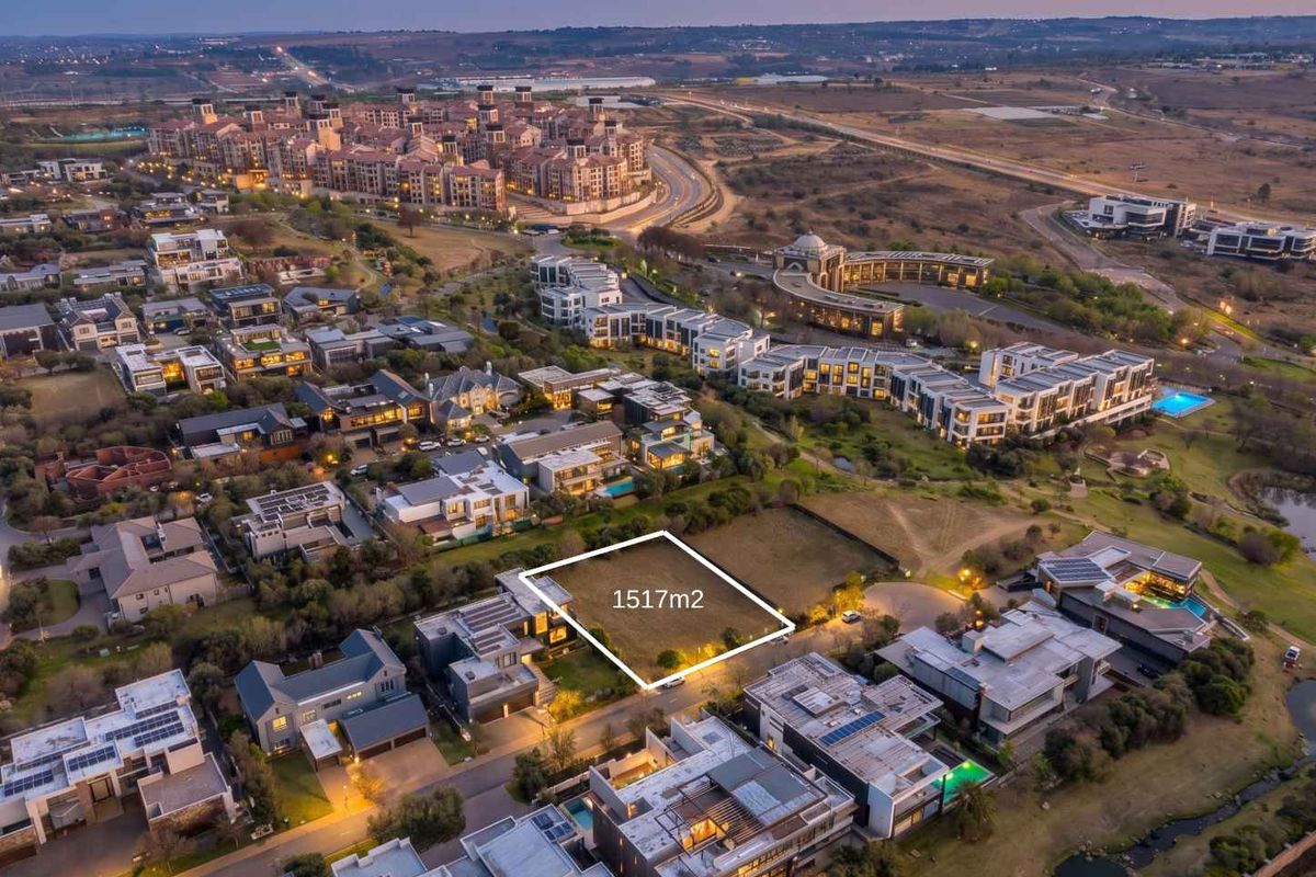 An aerial view of a 1517m2 vacant residential plot situated within a developed, modern residential estate.