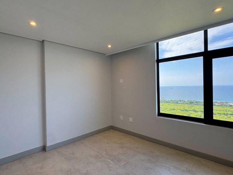 This brand-new, never-before-lived-in apartment offers a refined coastal lifestyle with breathtaking panoramic sea views and sleek, modern finishes throughout - Photo 8