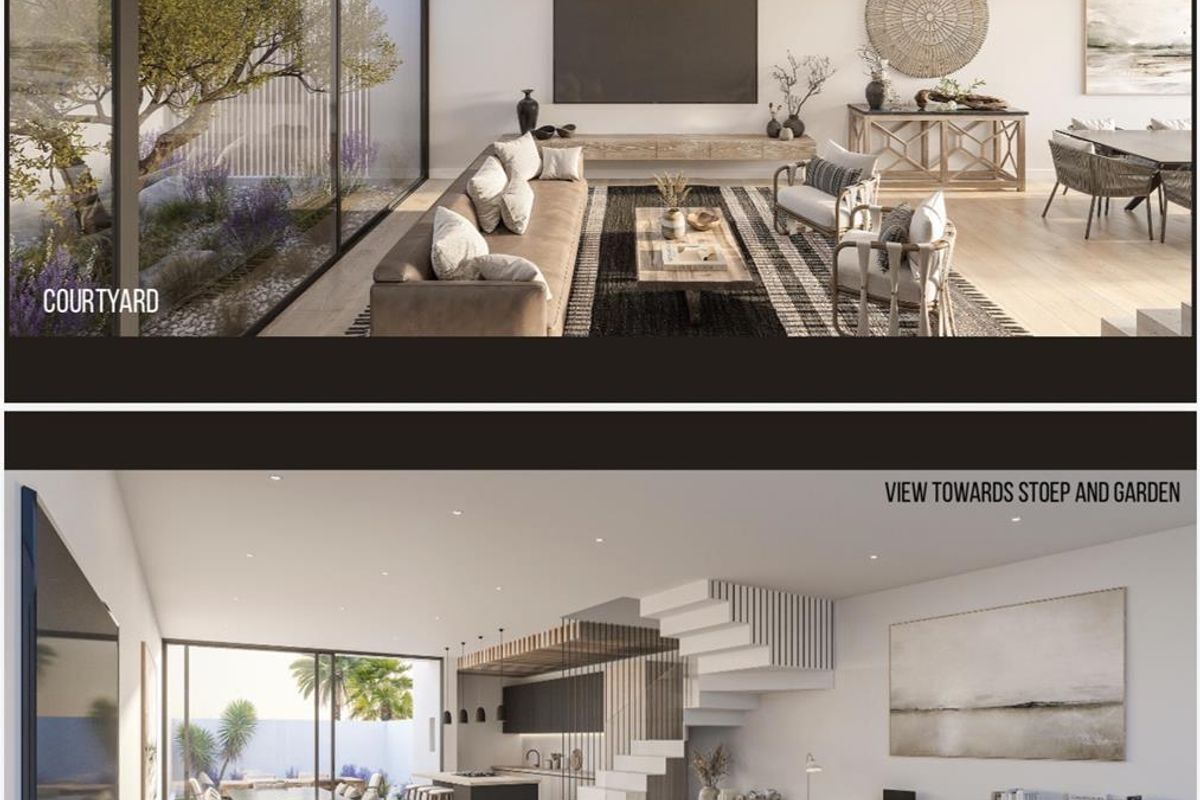 Modern open-plan living area featuring a sleek kitchen, integrated staircase, and large sliding glass doors opening to a private courtyard.