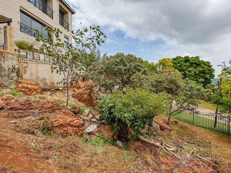 Nestled in a sought-after estate in Pretoria East, this exceptional 431 sqm parcel of land offers a rare opportunity to build your dream home in a setting of timeless beauty. With sweeping, breathtaking views, this is the closest you’ll come to the e - Photo 9