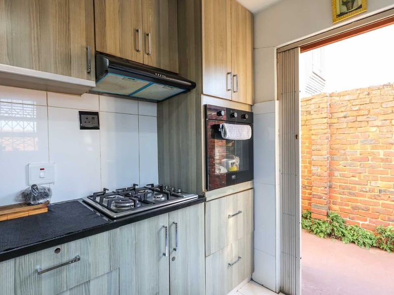 Stylish 3-Bedroom Duplex- Entertain In Style with Private Garden and Built In Braai - Photo 8
