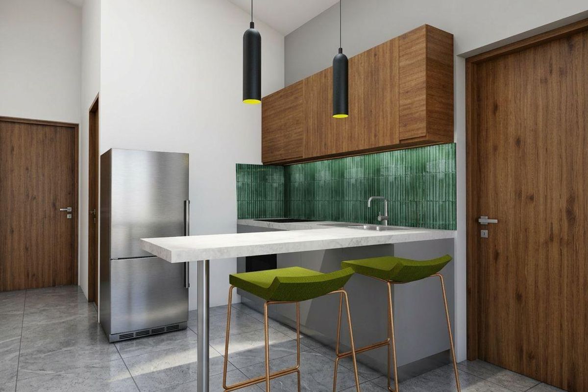 Modern kitchen featuring wood-tone cabinetry, a striking green tiled backsplash, stone countertops, and contemporary pendant lighting in a clean, minimalist layout.