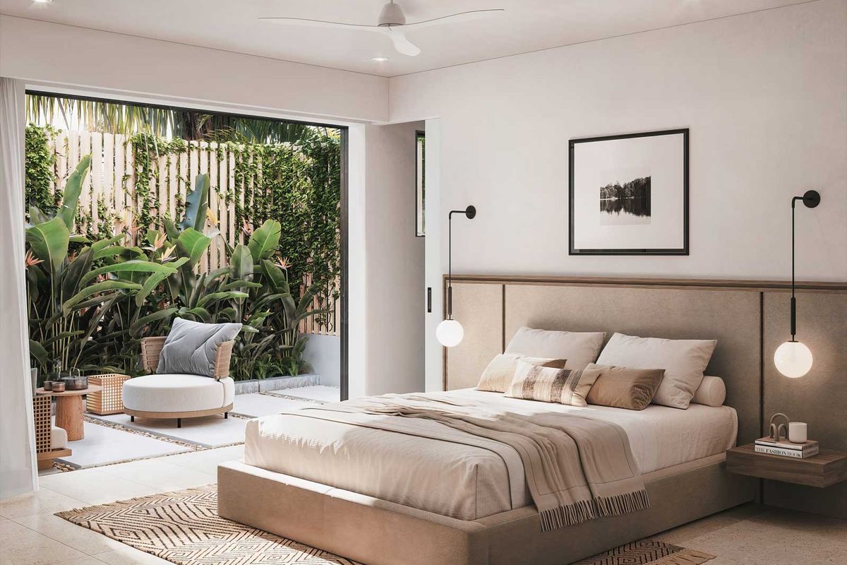 A modern bedroom featuring a built-in headboard, integrated wall lighting, and large sliding doors opening onto a private patio area.
