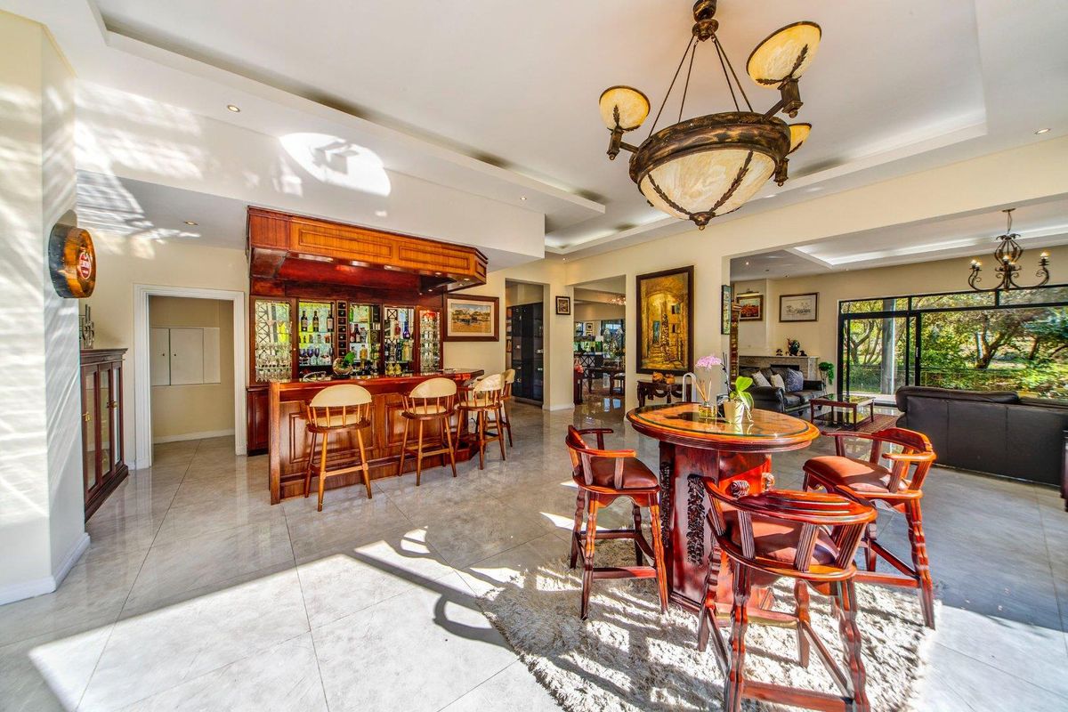 Indulge in the ultimate entertainment experience with a spacious bar and rooftop area - Photo 5