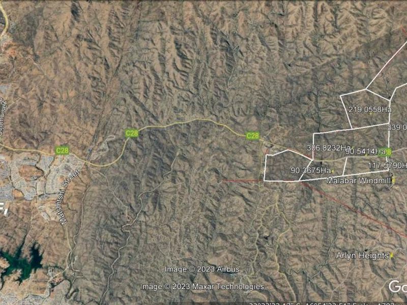 An aerial satellite view showing the layout and boundaries of multiple residential land parcels in a rural setting.