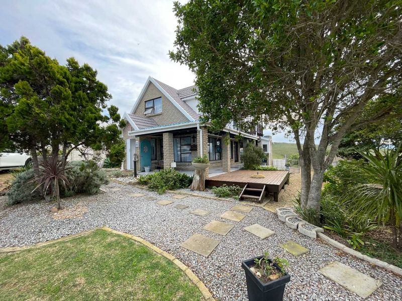 Prestigious Hartenbos Heuwels Home | 4 Bedrooms | Green Belt Views & Exceptional Privacy - Photo 2